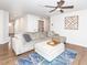 Bright living room with comfortable seating, modern decor, ceiling fan and plenty of natural light at 8630 Kenridge Ln, Fuquay Varina, NC 27526