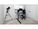 Bright office with a sit/stand desk, multiple monitors, and a comfortable chair at 8630 Kenridge Ln, Fuquay Varina, NC 27526