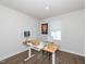 Well-lit home office featuring hardwood floors, a stylish desk, and neutral decor at 8630 Kenridge Ln, Fuquay Varina, NC 27526