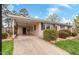 The front door of this cozy single-story home is covered by a long porch supported by columns at 902 Long Ave, Garner, NC 27529