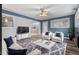Spacious living room with stylish furniture, a large TV, and ample natural light at 902 Long Ave, Garner, NC 27529