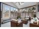 Relaxing sunroom with comfortable seating, large windows, and a bright, airy atmosphere at 902 Long Ave, Garner, NC 27529