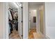 Bathroom with walk-in closet and adjacent shower, designed for accessibility at 902 Loop Rd, Clayton, NC 27527