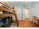 A view of the lofted bed area with the ladder and toy area at 902 Loop Rd, Clayton, NC 27527