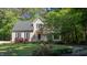 Charming two-story home with green shutters and a beautifully maintained front yard at 902 Loop Rd, Clayton, NC 27527
