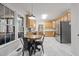 Spacious kitchen with stainless steel appliances, light wood cabinets, and eat in breakfast table at 902 Loop Rd, Clayton, NC 27527