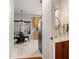 The well-lit nook includes a small bathroom and a breakfast area with a marble floor and view of the woods at 902 Loop Rd, Clayton, NC 27527