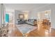 Sunlit living room featuring hardwood floors, neutral paint, and lots of natural light at 902 Loop Rd, Clayton, NC 27527