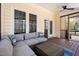 Comfortable outdoor screened porch with modern seating and peaceful view at 902 Loop Rd, Clayton, NC 27527