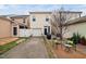 Backyard featuring a patio set, grill, and driveway leading to a single-car garage at 992 Ambergate, Apex, NC 27502