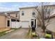 Backyard featuring a patio set, grill, and driveway leading to a single-car garage at 992 Ambergate, Apex, NC 27502