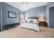 Cozy primary bedroom features a vaulted ceiling, soft carpet, and neutral decor at 992 Ambergate, Apex, NC 27502