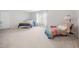 Spacious bedroom with two twin beds, a window, and a comfortable seating area at 992 Ambergate, Apex, NC 27502