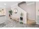 Inviting entryway with decorative bench, interior decor, and easy access to the stairs at 992 Ambergate, Apex, NC 27502