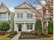 Inviting two-story home with a lovely balcony, manicured landscaping, and classic architectural details at 992 Ambergate, Apex, NC 27502