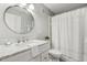 Bright bathroom with marble countertops, brushed metal faucets, and framed mirror at 100 Hunting Chase # 1-B, Cary, NC 27513