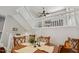 The dining room boasts a round table set for six beneath a lofty ceiling and adjacent to the staircase at 100 Hunting Chase # 1-B, Cary, NC 27513