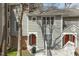 Neutral-toned townhouse features a charming red front door with a wreath accent at 100 Hunting Chase # 1-B, Cary, NC 27513
