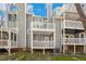 Rear view of multilevel decks for condo units, perfect for enjoying the outdoors at 100 Hunting Chase # 1-B, Cary, NC 27513