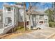 Charming townhome featuring a welcoming walkway and a traditional facade with muted neutral colors at 100 Hunting Chase # 1-B, Cary, NC 27513