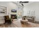 Bright living room featuring a fireplace, vaulted ceilings, large windows, and neutral decor at 100 Hunting Chase # 1-B, Cary, NC 27513