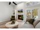 Bright living room featuring a fireplace, vaulted ceilings, large windows, and neutral decor at 100 Hunting Chase # 1-B, Cary, NC 27513