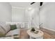 Living room with stairs to second level, wood laminate floors and neutral colors at 100 Hunting Chase # 1-B, Cary, NC 27513