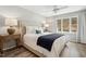 Serene main bedroom with natural light, calming colors, and a ceiling fan at 100 Hunting Chase # 1-B, Cary, NC 27513