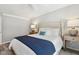 Serene main bedroom with natural light, calming colors, side tables and a ceiling fan at 100 Hunting Chase # 1-B, Cary, NC 27513