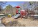 Community playground with colorful equipment, including a slide, climbing structures, and swing set at 100 Hunting Chase # 1-B, Cary, NC 27513