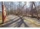 Picturesque gravel walking trail lined with mature trees, perfect for a leisurely stroll or outdoor exercise at 100 Hunting Chase # 1-B, Cary, NC 27513
