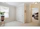 Bedroom with a window for natural light and doorway to an adjacent bedroom at 101 Whitney Ln, Durham, NC 27713