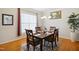 Elegant dining room with hardwood floors, a chandelier, and ample natural light at 101 Whitney Ln, Durham, NC 27713