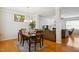 Inviting dining area with hardwood floors open to a comfortable living room space at 101 Whitney Ln, Durham, NC 27713
