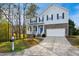 Beautiful two-story home with a well-kept lawn, two-car garage, and inviting front porch at 101 Whitney Ln, Durham, NC 27713
