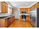 Spacious kitchen with stainless steel appliances, wood cabinets, and hardwood floors at 101 Whitney Ln, Durham, NC 27713