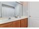 A classic bathroom boasts a double sink vanity and a shower behind a curtain at 10841 Round Brook Cir, Raleigh, NC 27617