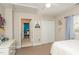 A sunlit bedroom offers closet space and a connecting door to a bathroom at 10841 Round Brook Cir, Raleigh, NC 27617