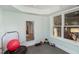Bright exercise room featuring fitness ball, a trampoline, and a large window with natural light at 10841 Round Brook Cir, Raleigh, NC 27617