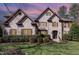 Stunning brick home with manicured landscaping and a charming facade at 10841 Round Brook Cir, Raleigh, NC 27617