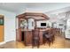 Entertainment area includes a bar with seating and a view of the adjacent living space at 10841 Round Brook Cir, Raleigh, NC 27617