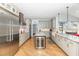 Elegant kitchen with stainless steel appliances, granite counters, and hardwood floors at 10841 Round Brook Cir, Raleigh, NC 27617