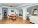Open-concept living room features a round table, wood chairs, and polished concrete floors at 10841 Round Brook Cir, Raleigh, NC 27617