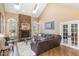 Inviting living room with stone fireplace, skylights, and comfortable seating at 10841 Round Brook Cir, Raleigh, NC 27617