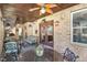 Charming outdoor space includes a tiled floor, ceiling fans, and a view of manicured lawn at 10841 Round Brook Cir, Raleigh, NC 27617