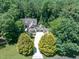 Expansive property surrounded by dense woodlands, featuring a long driveway leading to a custom-built home at 12117 Cliffside Cir, Raleigh, NC 27614