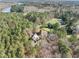 Lush, wooded property featuring a custom-built home, an in-ground pool, and sprawling green spaces at 12117 Cliffside Cir, Raleigh, NC 27614