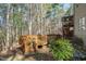Scenic view of a backyard deck with natural landscaping, providing a serene outdoor living space at 12117 Cliffside Cir, Raleigh, NC 27614