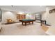 Basement rec room featuring a pool table, games, and carpeted flooring at 12117 Cliffside Cir, Raleigh, NC 27614
