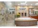 Elegant bathroom with a standalone tub, glass shower, and decorative accents at 12117 Cliffside Cir, Raleigh, NC 27614